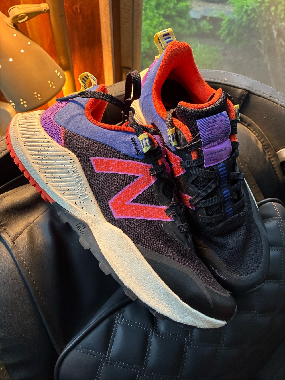New Balance women’s Black, Purple & Orange Trail Sneakers